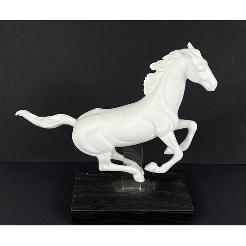 403 - Lladro, a white matt porcelain figure of a horse, 