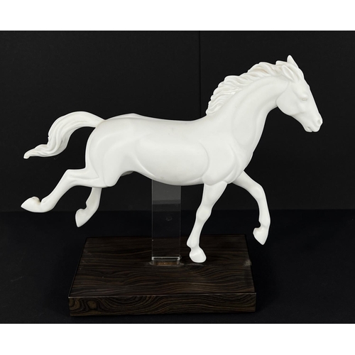 404 - Lladro, a white matt porcelain figure of a horse, 