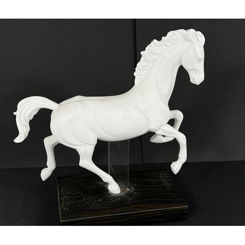 405 - Lladro, a white matt porcelain figure of a horse, 