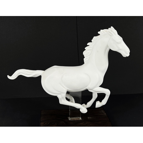 406 - Lladro, a white matt porcelain figure of a horse, 