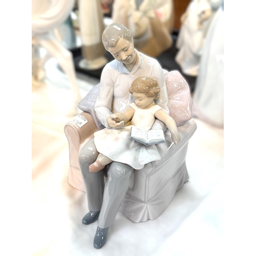 411A - A Lladro group of grandfather and granddaughter seated in armchair - Grandfather's Stories, with box... 