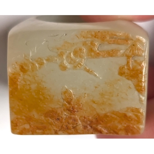 414B - A large Chinese jade coloured seal ring with incised picture to the table