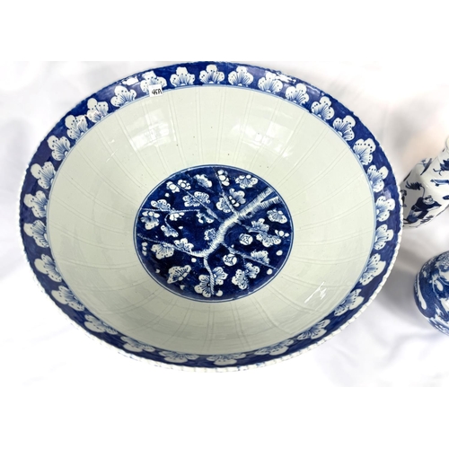 415A - A large Chinese blue and white bowl with floral decoration, ribbed, seal mark to base, diameter 40cm... 