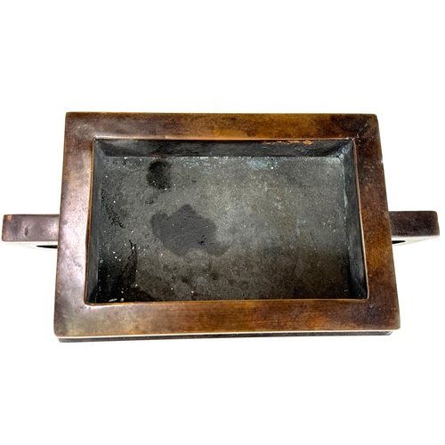 415B - A Chinese bronze censer with inlaid white metal decoration to the body and base, of rectangular form... 