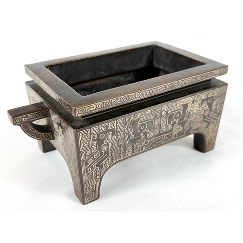 415B - A Chinese bronze censer with inlaid white metal decoration to the body and base, of rectangular form... 