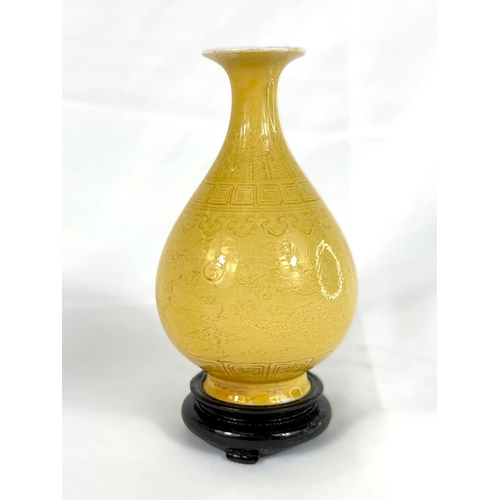 415D - A Chinese yellow ground small vase with incised decoration, with stand height 12cm, seal mark to bas... 