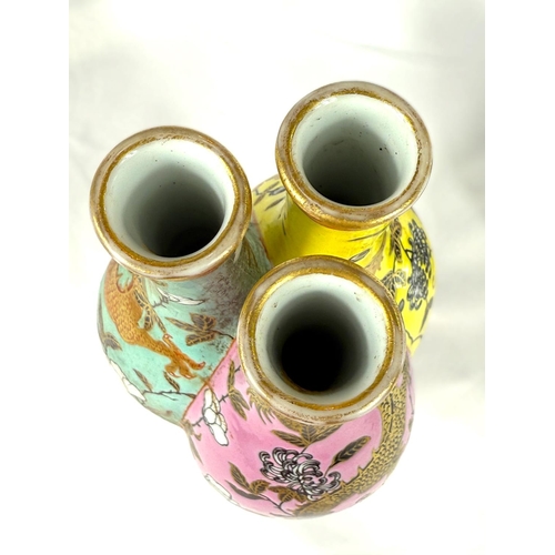 416B - A Chinese 'trio' vase with green, yellow and pink sides each with neck, dragons to the panels six ch... 