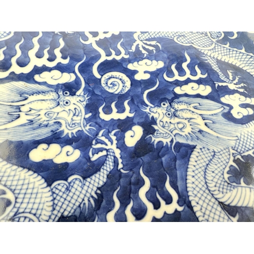 416C - A pair of Chinese blue and white dragon plates with five claws to each, six character marks to the r... 