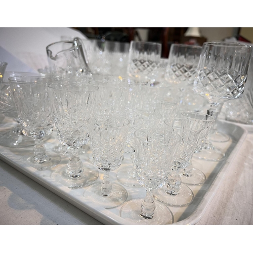 452 - A large selection of cut drinking glasses - tumblers, wines, champagnes etc.