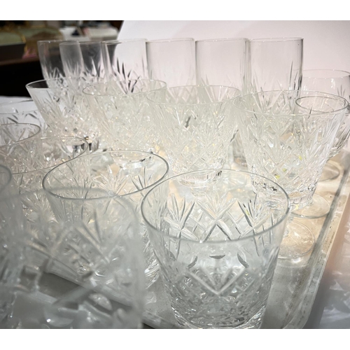 452 - A large selection of cut drinking glasses - tumblers, wines, champagnes etc.