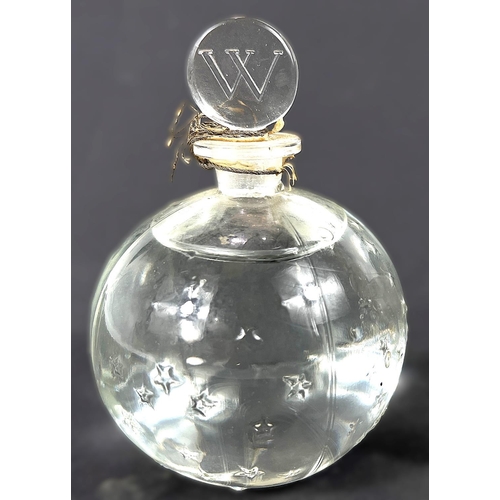 463 - LALIQUE: a bulbous perfume bottle with scattered embossed stars in the 'Flacon Dans La Nuit' design,... 