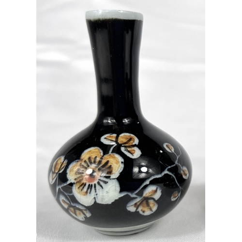 470 - An unusual Famille Noire Dutch 'Black Scratch' Royal Delft tear bottle and another similar, hts 9cm ... 