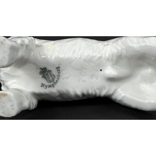 475 - A NYMPHENBURG porcelain figure of a West Highland white terrier, length 15cm.