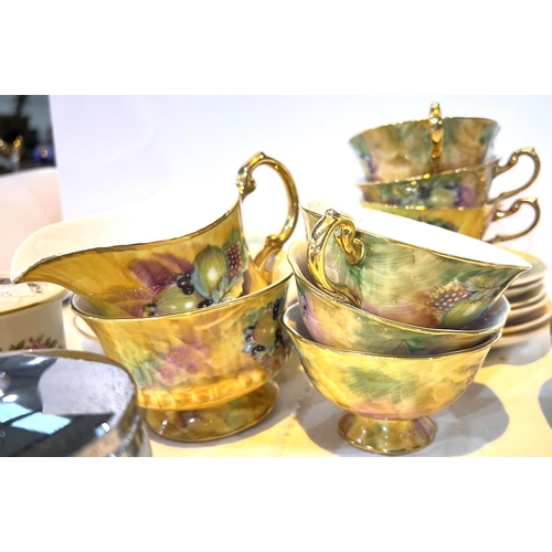 525 - A collection of Aynsley Golden style hand painted tea ware and similar china.