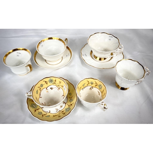 542 - A rare Rockingham trio set with yellow, green and gilt border, saucer with puce griffin mark; and tw... 