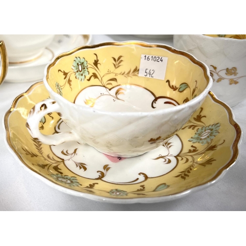 542 - A rare Rockingham trio set with yellow, green and gilt border, saucer with puce griffin mark; and tw... 