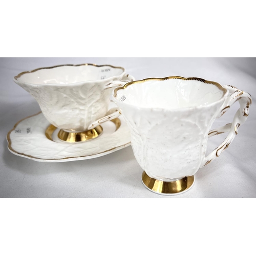 542 - A rare Rockingham trio set with yellow, green and gilt border, saucer with puce griffin mark; and tw... 