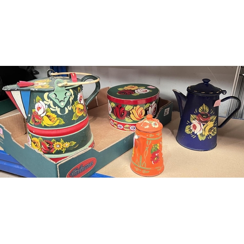 55 - A Bargeware style brightly painted watering can; a similar coffee can and another smaller; a similar... 