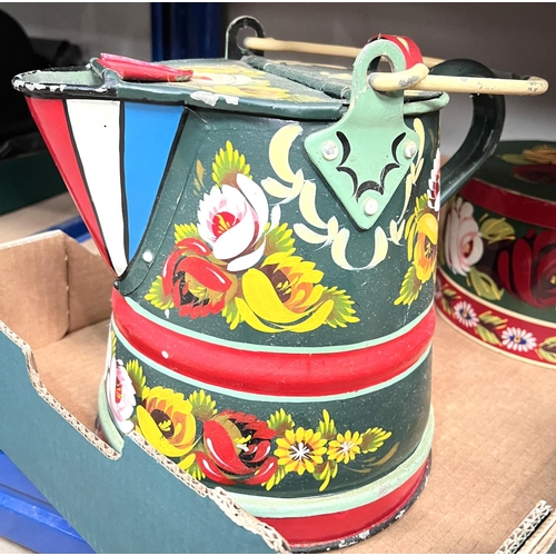 55 - A Bargeware style brightly painted watering can; a similar coffee can and another smaller; a similar... 