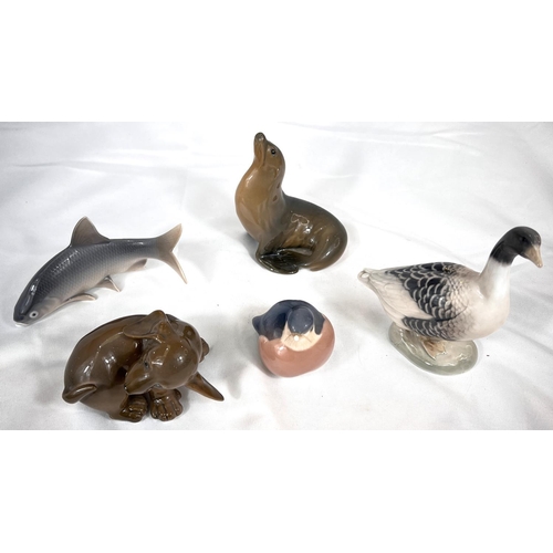 557 - ROYAL COPENHAGEN, porcelain cabinet figures, a puppy, a seal, a goose and a wren (beak a/f)