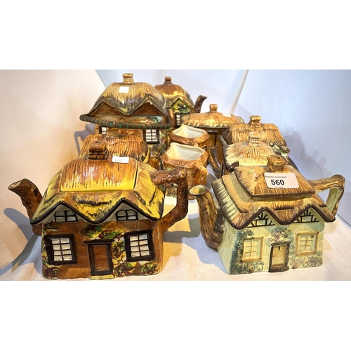 560 - A collection of cottage ware, tea pots, jugs etc.