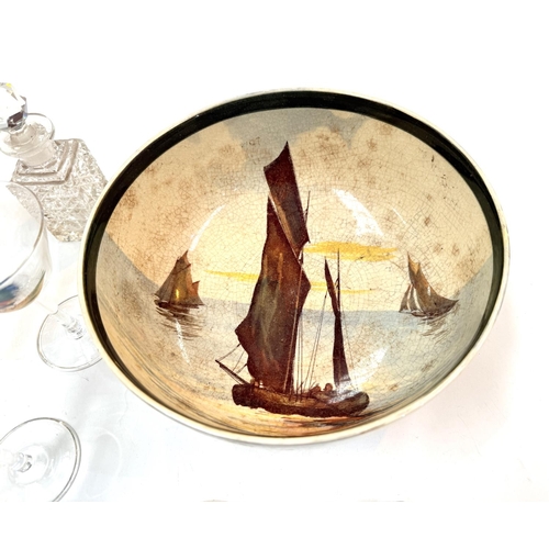 568 - A Royal Doulton bowl decorated with yachts, No D2872; a mid 20th century cocktail set decorated with... 