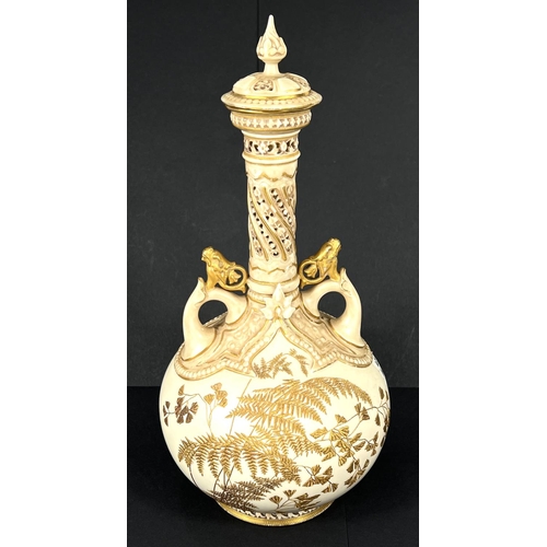 575 - A Worcester porcelain covered vase with tall slender neck decorated in the Aesthetic style with gilt... 