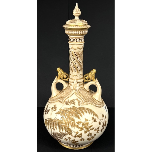 575 - A Worcester porcelain covered vase with tall slender neck decorated in the Aesthetic style with gilt... 