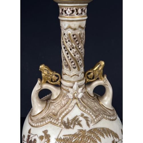 575 - A Worcester porcelain covered vase with tall slender neck decorated in the Aesthetic style with gilt... 