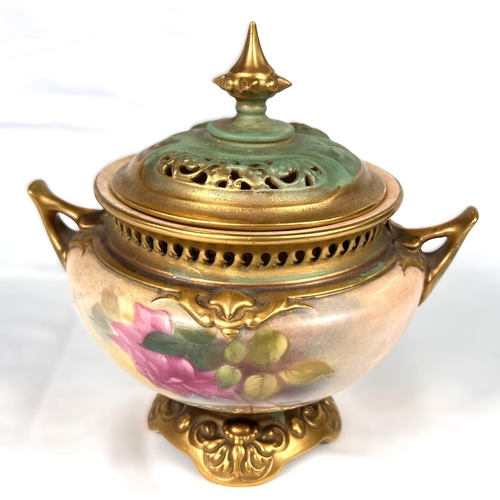 579 - ROYAL WORCESTER: a two handled potpourri decorated in enamels with roses, 15cm