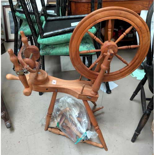 58 - A modern pine spinning wheel with attachments.