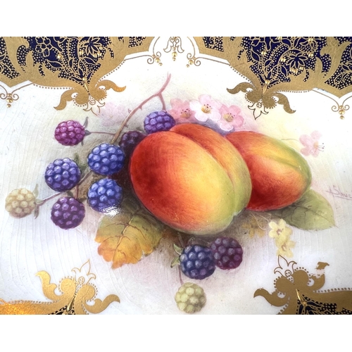 594 - Royal Worcester: an oval porcelain fruit dish decorated with peaches and blackberries, signed A SHUC... 