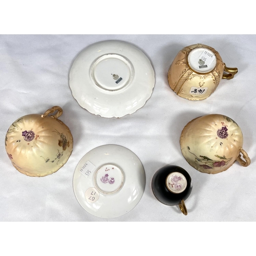 595 - Royal Worcester: a gilded blak cabinet cup and saucer, another with peach ground and a further pair ... 