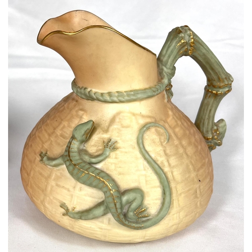 600 - Royal Worcester: a peach ground jug with textured basketry finish and applied lizzard Rd No 226402, ... 