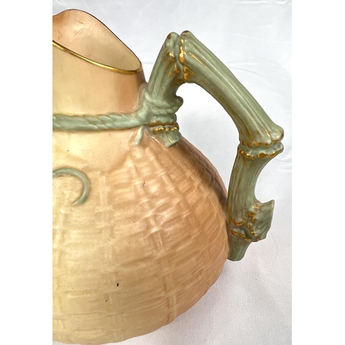 600 - Royal Worcester: a peach ground jug with textured basketry finish and applied lizzard Rd No 226402, ... 