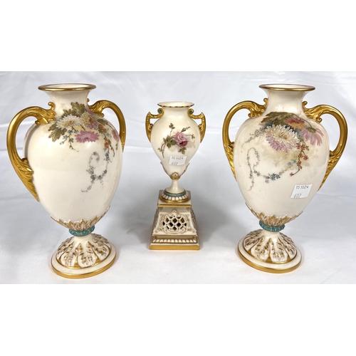 602 - a pair of two handled baluster pedestal vases decorated with enamelled floral sprays, 19cm Rd No 327... 