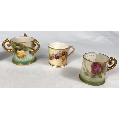 603 - Royal Worcester: A peach ground miniature mug decorated with flowers, 4cm, a similar pair (one a.f.0... 