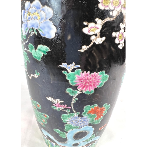 611 - An Eastern porcelain vase circa. 1920 decorated in the famille noir palette, 30cm.