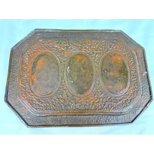 625A - An unusual 19th century Indian Bronzed copper tray with panel decoration of deities, 40.5cm