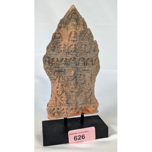 626 - An early Burmese or Khmer clay votive tablet on stand.