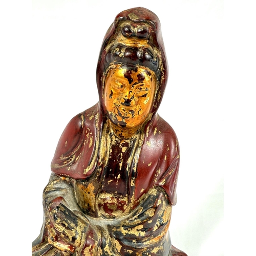 626A - A possibly early  Chinese carved wooden figure of Guanyin, gilt and red lacquer, height 30cm&nb... 