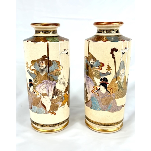 627A - A pair of Japanese Taisho period Satsuma vases, finely decorated with the seven immortals, marks to ... 