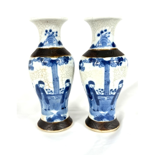 628A - A pair of Chinese blue and white crackle glazed vases circa 1900, heights 20cm