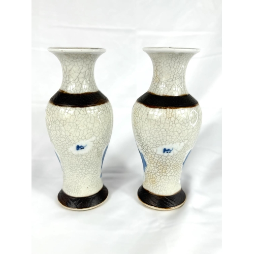 628A - A pair of Chinese blue and white crackle glazed vases circa 1900, heights 20cm