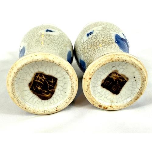 628A - A pair of Chinese blue and white crackle glazed vases circa 1900, heights 20cm