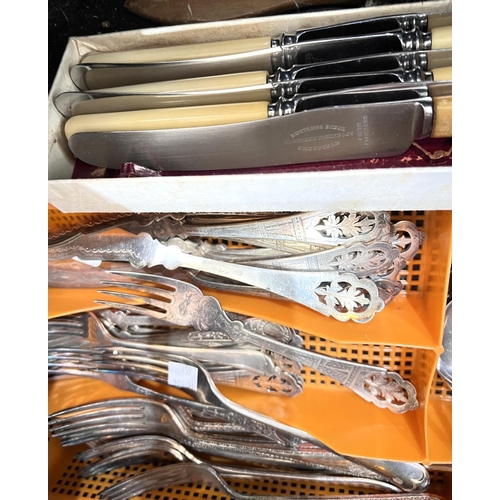 654 - A set of unusual silver-plated fish servers with pierced ends, other similar silver-plated cutlery.