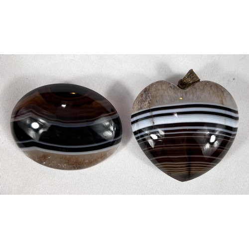 657 - A Sardonyx heart shaped pendant, 19th century 45mm and a similar brooch.