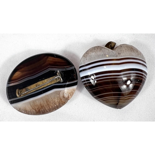 657 - A Sardonyx heart shaped pendant, 19th century 45mm and a similar brooch.