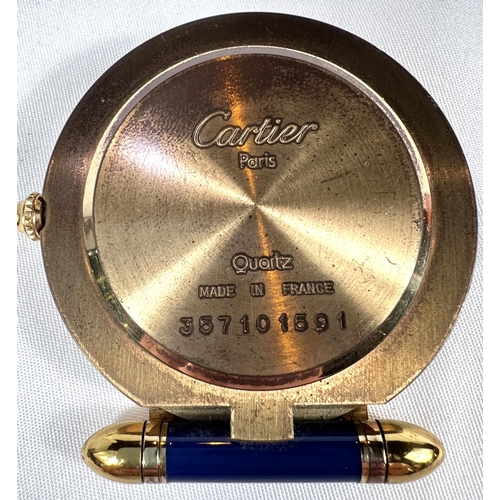 660 - CARTIER, a modern enamelled gilt brass travel clock, 54mm diameter