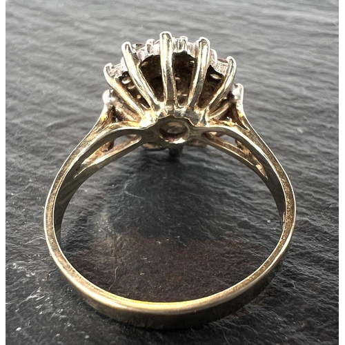 680 - A 9ct yellow gold ring with 19 diamonds in flowerhead setting, 3.8gm gross.